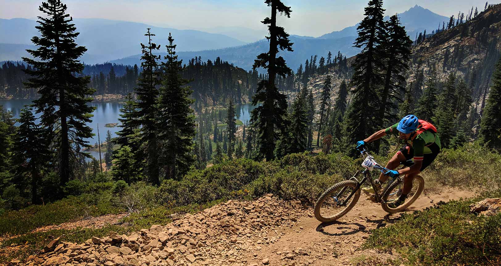 mountain bike racer above Deer Lake on the Sierra summit